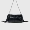 Bolso tipo riñonera Miss M de charol