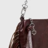 Bolso tipo riñonera Miss M de charol