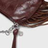 Bolso tipo riñonera Miss M de charol