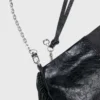Bolso tipo riñonera Miss M de charol