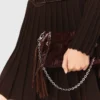 Bolso tipo riñonera Miss M de charol