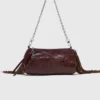Bolso tipo riñonera Miss M de charol