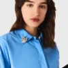 Camisa con adornos extraíbles Camisa con adornos extraíbles