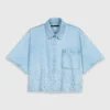 Camisa vaquera corta con pedrería