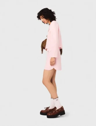 Falda corta de punto con pespuntes