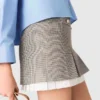 Falda plisada con detalles de popelín