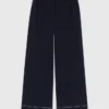 Pantalones de algodón con cinturón de cuero