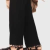 Pantalones de punto con pedrería Pantalones de punto con pedrería