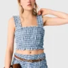 Top de algodón con smocks y pedrería