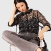 Top floral con lentejuelas
