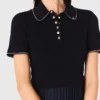 Vestido con cuello polo y minipliés Vestido con cuello polo y minipliés