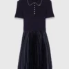 Vestido con cuello polo y minipliés Vestido con cuello polo y minipliés