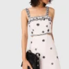 Vestido largo con aberturas bordadas